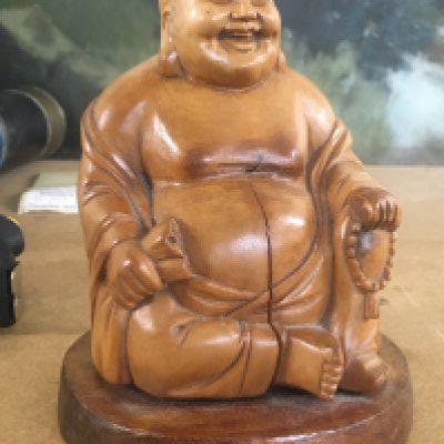 A small carved Buddha 13 cm