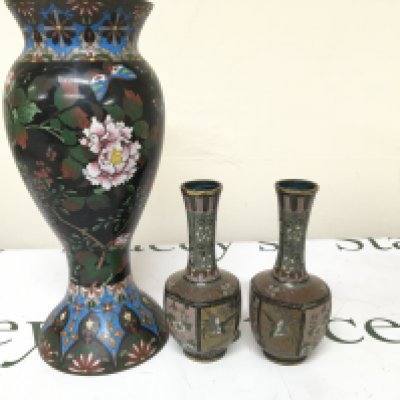 A Pair of later 19th century Cloisonne vases of octagonal shape (damaged) a large Cloisonne Vase decorated with flowers and foliage on a black ground. Height 29cm (3)