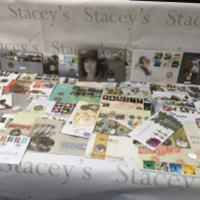A collection of coin and stamp presentations packs. Postage B