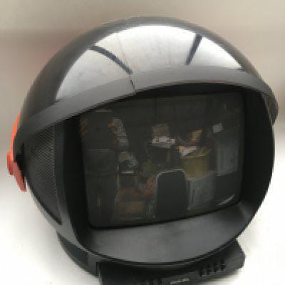 Two 1980s Philips Discoverer TV and a remote control.