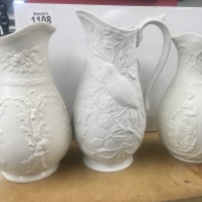 A Collection of eleven Victorian white glazed jugs of classical influences. NO RESERVE