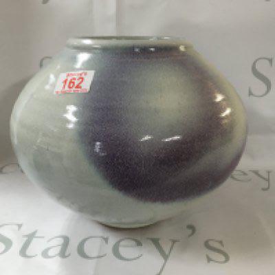 Studio pottery vase around 23.5cm tall.