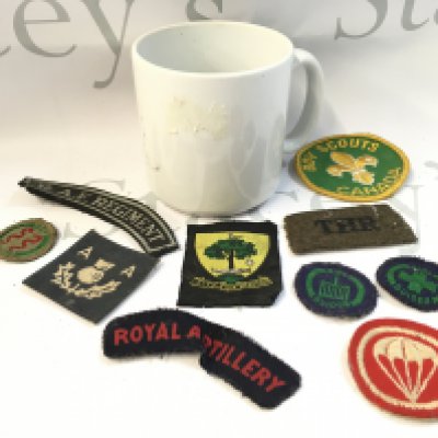 A WW2 German Third Reich 1939 mug and a Collection of cloth badges including RAF, Royal Artillery