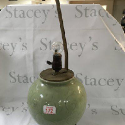 Chinese vase lamp on a pedestal.