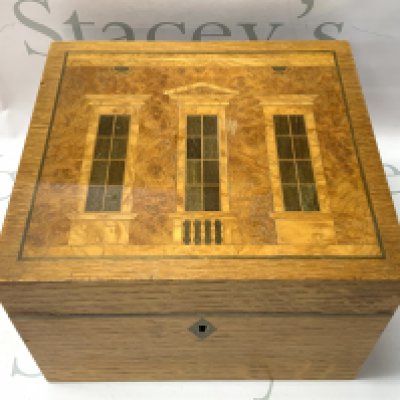 An inlaid wood humidor made by David Linley for Alfred Dunhill The top inlaid with a design inspired by Classical architecture. 24cm x 22cm x 16cm