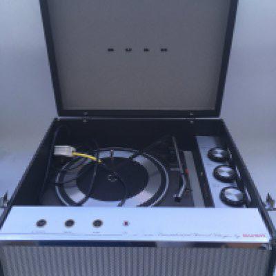 Two vintage portable record players comprising a circa 1960s Bush example and a KB radio tune time model (2).