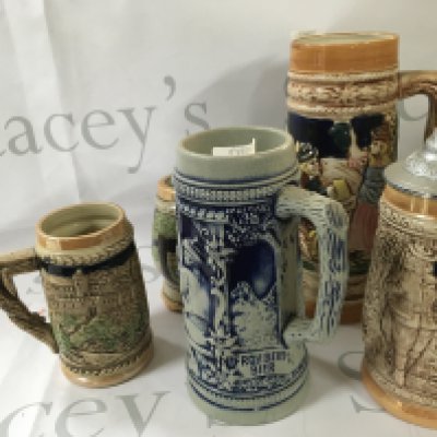 A range of antique vintage mugs and cups with unique designs, made in Germany.