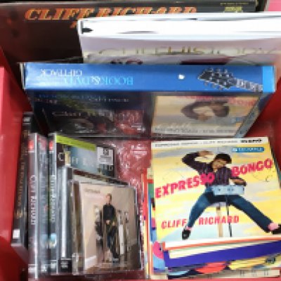 A Collection of Cliff Richard ephemera includes DVDs, 7 inch singles etc