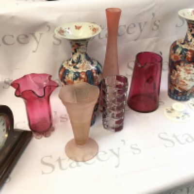 A collection of ceramics including Imari ware vases, pink glass vases, wooden mantle clock with inlaid design