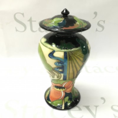 A Moorcroft vase. Approximately 23cm tall.