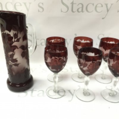 A set of cameo ruby flash wine glasses and a pitcher.