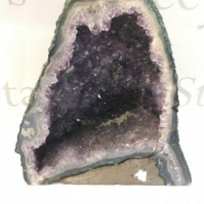 An Ameythst Geode 24cm tall 22cm wide