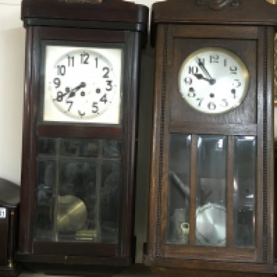 Two wall clocks. Both approximately 86cm tall and 32cm wide, Postage D. NO RESERVE