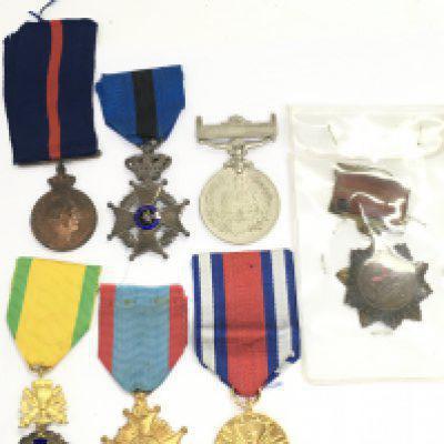 A Collection of military medals including a China 1954 merit, Polish peoples public medal, Belgium Telegraphic Service medal, French military third republic medal, 1956 Islamic Republic of Pakistan commemorative medal, Greek army medal, Belgium Order of Leopold II Medal. Postage category A. NO RESERVE