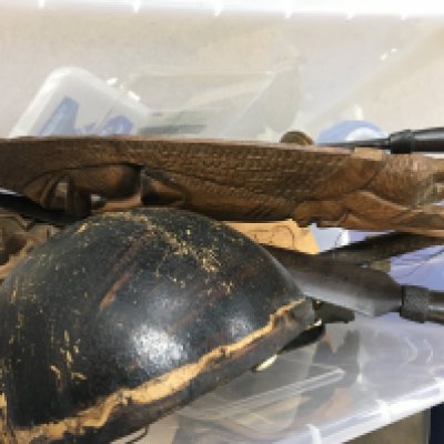 A Collection of African wooden masks, spears etc