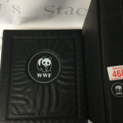 2 WWF books including the ring binder and the complete set of stamps.