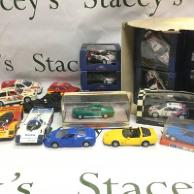 A collection of die cast vehicles including boxed and loose examples.