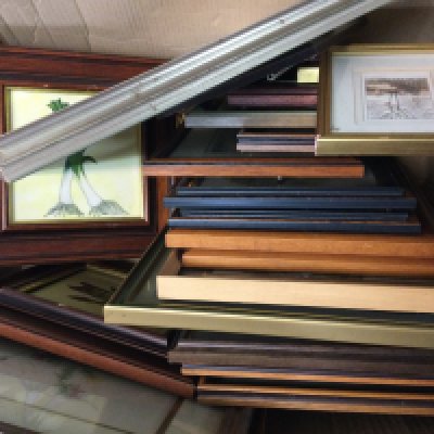 A framed collection of watercolours and prints.