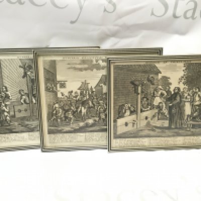 A collection of three framed engravings in the Hogarth style