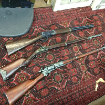 Toy rifles including lever action, revolving and flintlock styles
