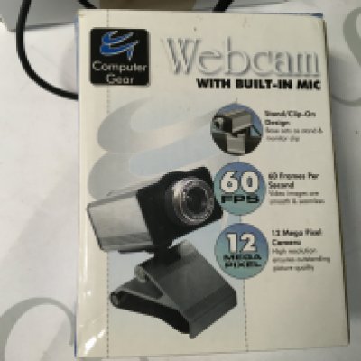 2 antique clocks and 2 webcams, including the Logitech C920, a webcam with a built in mic, clip on design, 60FPS and a 12 mega pixel camera.