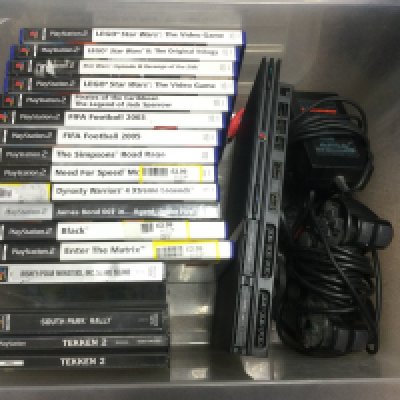 A slimline PS2 Playstation console, games and accessories.