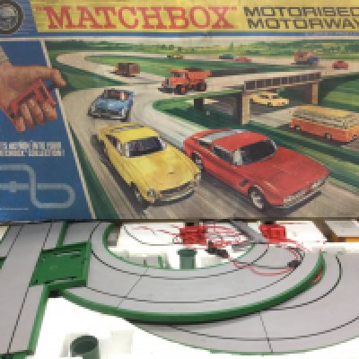 Three boxed racing games comprising a Matchbox M2 motorised motorway, a Tyco Nigel Mansell racing set and a Matchbox Powertrack 3000.