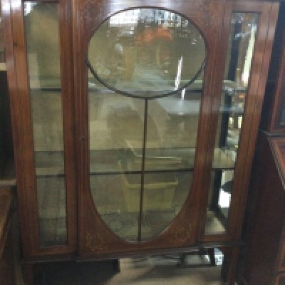 A Edwardian mahogany display cabinet the glazed door enclosing fitted shelves on cabriole Legs . NO RESERVE