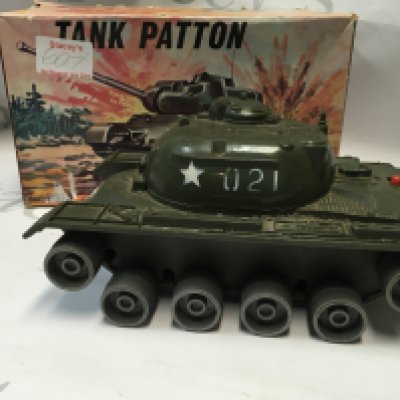 A vintage tank Patton tank toy, a battery operated toy made in Japan. Also there is a vintage Pelham Puppet, made in 1963.