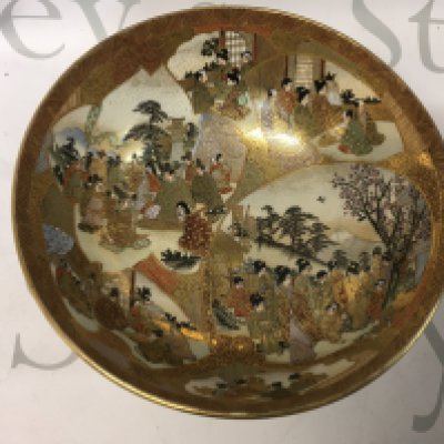 A Satsuma ware bowl decorated with various figures and scenes, approx diameter 18cm.