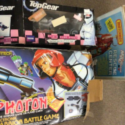 A collection of boxed vintage toys including a Matchbox MAC Rescue center play set, Top Gear stigs race buggy, Photon electronic warrior battle game