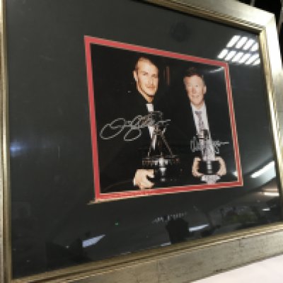 A collection of signed framed pictures apart from Muhammad Ali, including David Beckham and Sir Alex Furgesson, Muhammad Ali, Wayne Rooney and Steven Gerrard.
