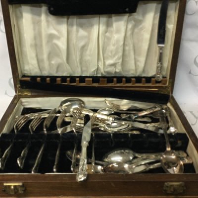 A collection of items including a silver-plated cutlery set from Smith Seymour Ltd. , a Brooklyn Models Lansdowne LDM 9 1953 Austin Somerset which a 1/43 scale model, a cutlery set made by Ward and Brown Watchmakers and Jewellers, a collection of silver and gold-plated items, 6. E,on spoons by Butler Cutlery, another cutlery set, and more.