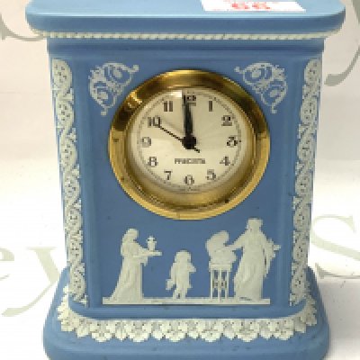 A Wedgewood porcelain mantle clock. 16cm.