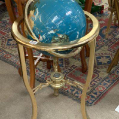 A brass free standing stone inlaid globe. (D)