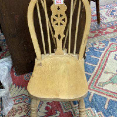 An Antique Childs Beech wheel back chair. (D)