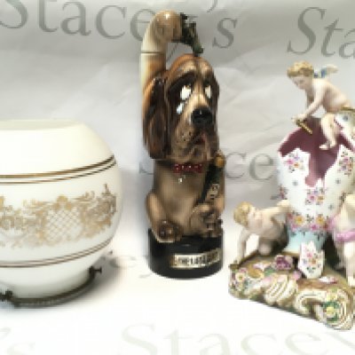 A glass lamp shade, Bond Ware blood hound vintage last shot porcelain whiskey container/ music box and a Dresden broken vase with putti figure group