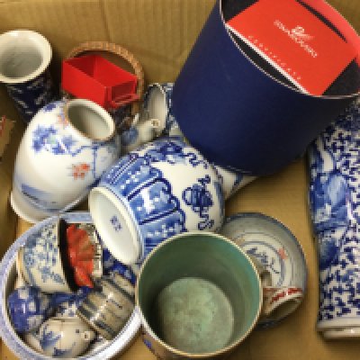 A box of Oriental ceramics comprising mainly blue and white items.