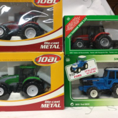 A collection of vintage 1:32 scale trucks from the Valera S Series and the Siku Farmer Series.