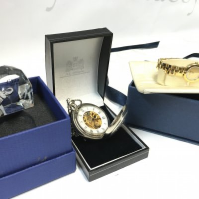 A boxed Swarovski miniature Cinta SCS 2013 paperweight, a pocket watch (seen working) , Raymond Weil watch