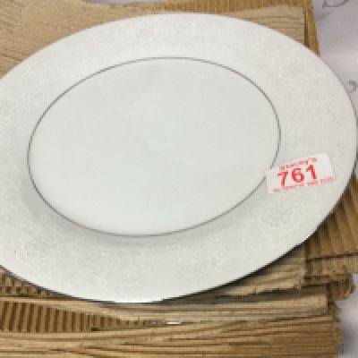 A collection of identical antique plates made by Crown Ming which includes a white plate with a grey border with white flowers.
