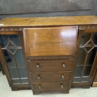 A 1950s glazed oak bookcase/ bureau. 102cm x 106cm x 29cm