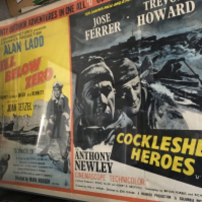 A large photo frame including 2 movie original vintage posters from Cockleshell Heroes and All Below Zero.