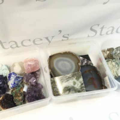 A Collection of crystal rocks including amethyst, rose quartz , malachite etc