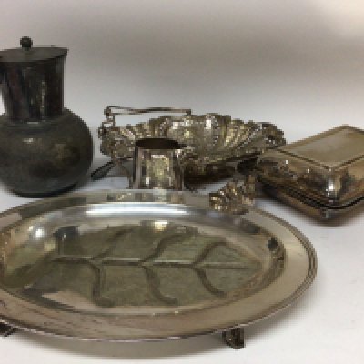 A collection of silver plate a meat dish basket cutlery and other silver plate.