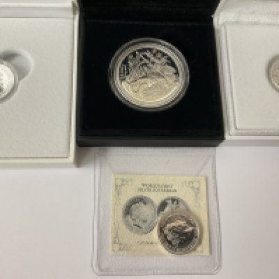 Seven cased silver sovereigns (London mint issue). Postage category B