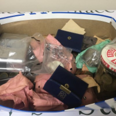A box containing a collection of British pre and post decimal coinage commemorative crowns and some Italian 1974 commemorative coinage in presentation packs.