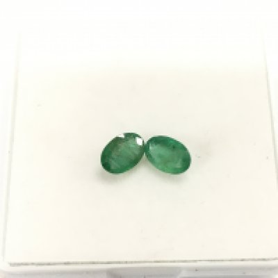 Pair of loose emeralds totalling 1.28ct. Postage B