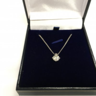 A platinum diamond solitaire pendant on a silver chain. Diamond Approx 0.91ct. Postage B