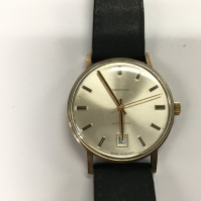 A gold cased gents Garrard wrist watch. 41.16g